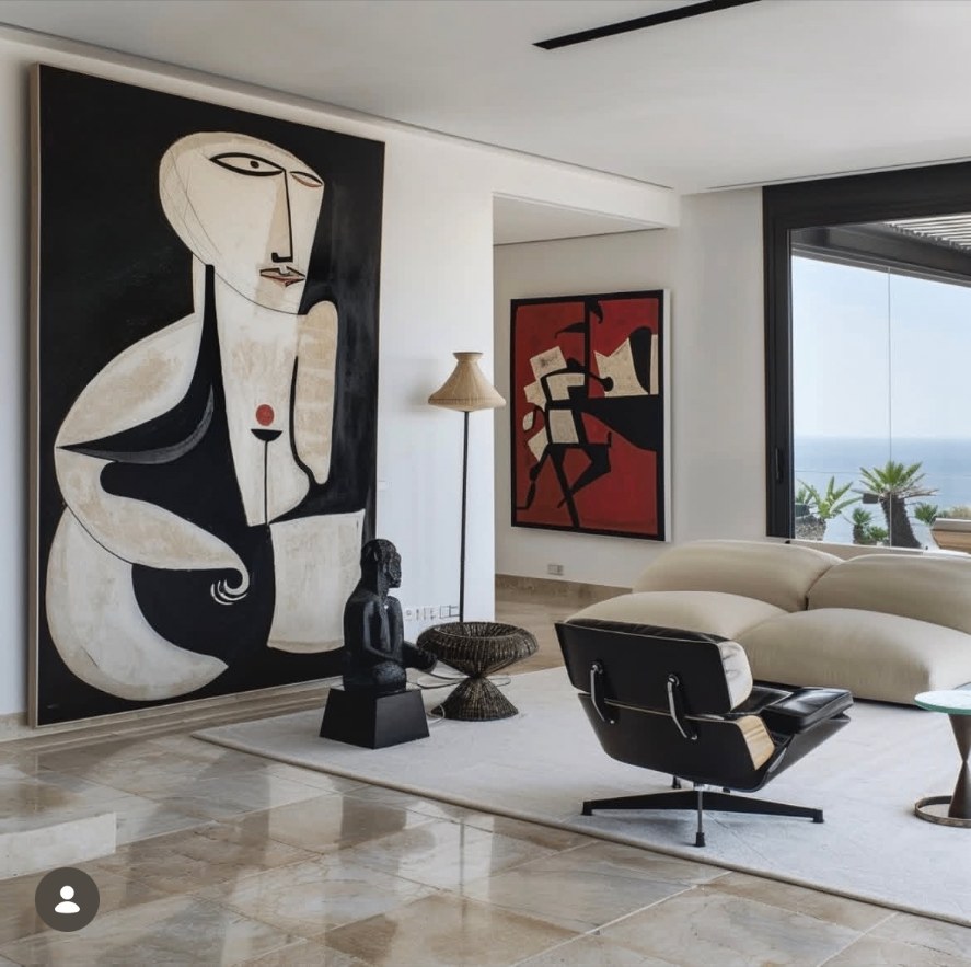 Inspiration salon minimaliste — grande œuvre murale et fauteuil Eames